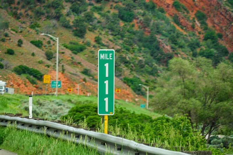 A highway sign with the number 111 on it