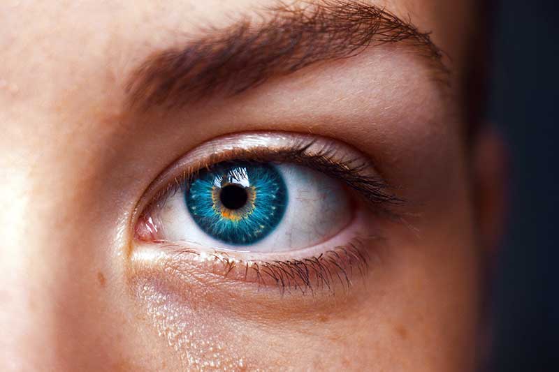 A person with a blue eye