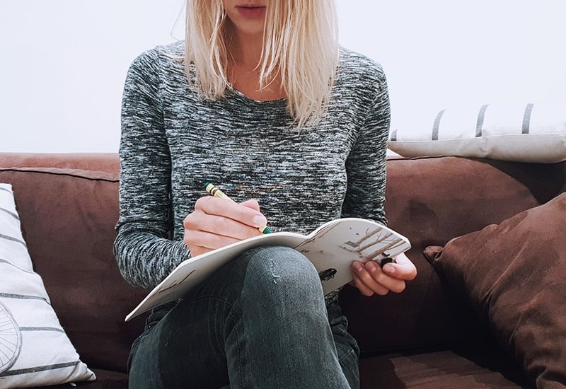 A woman writing in a journal