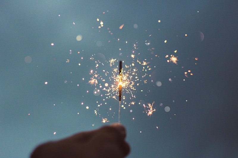 A person holding a sparkler