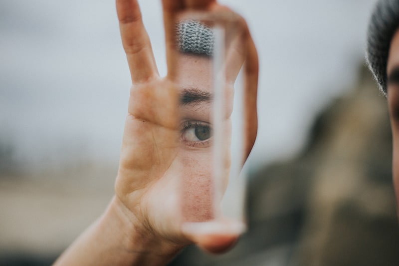 A persons eye reflecting off a mirror