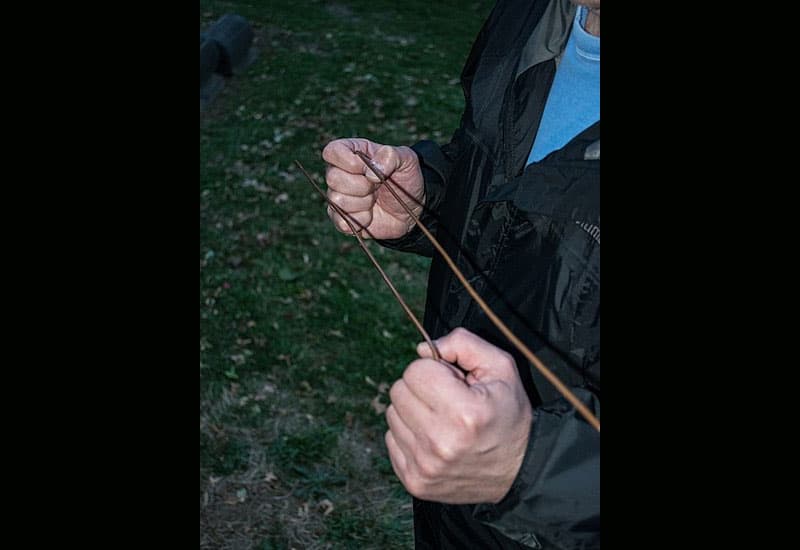 Person using dowsing rods